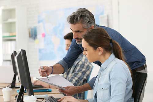 MercuryGate University - What We Provide - Instructor Helping Student